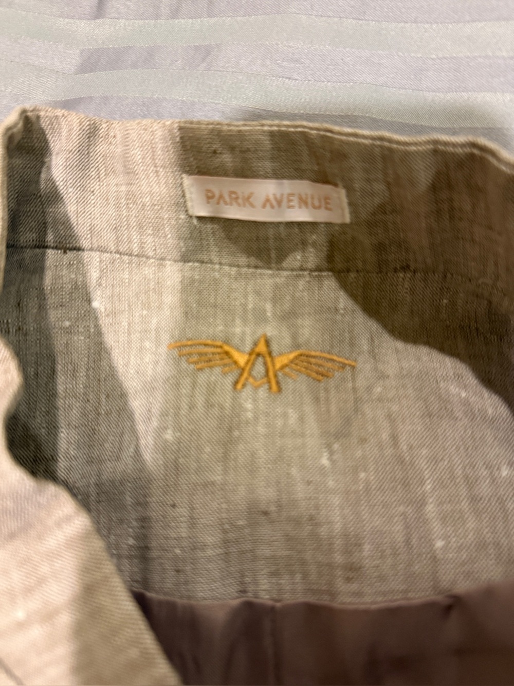 Avenue Men Nehru Jacket in Beige with Gold Emblem